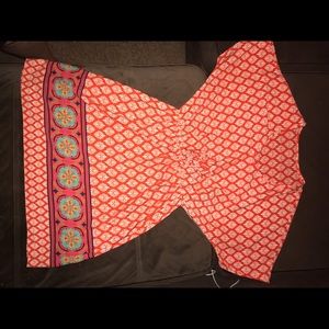 It is a free people and orange color. Summer dress